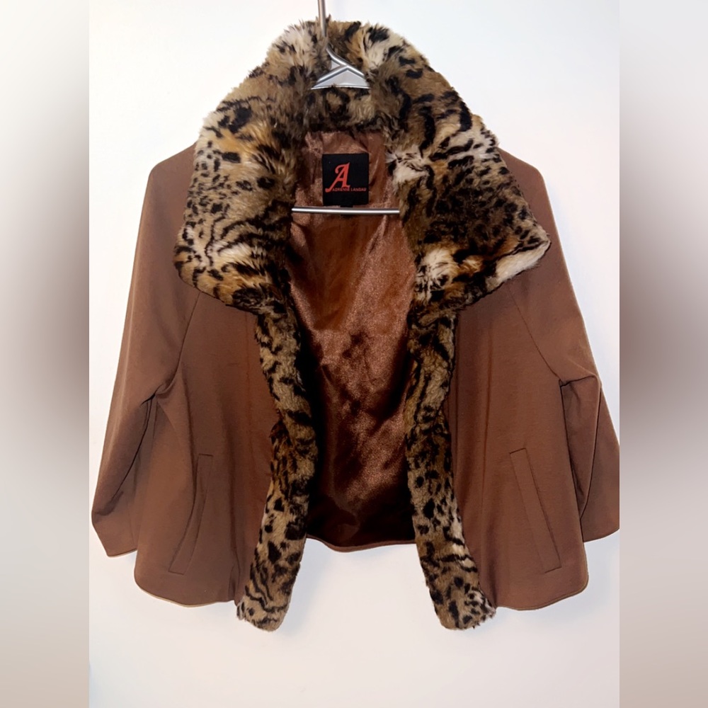 This Faux fur jacket is ideal for formal occasions, business meetings or casual